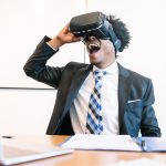 Businessman using VR glasses.